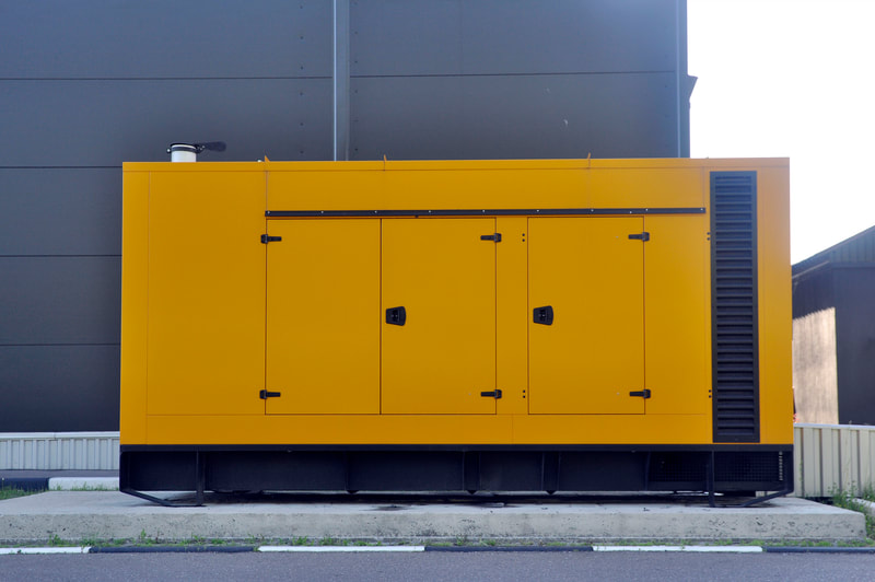 a large yellow box sitting on the side of a road